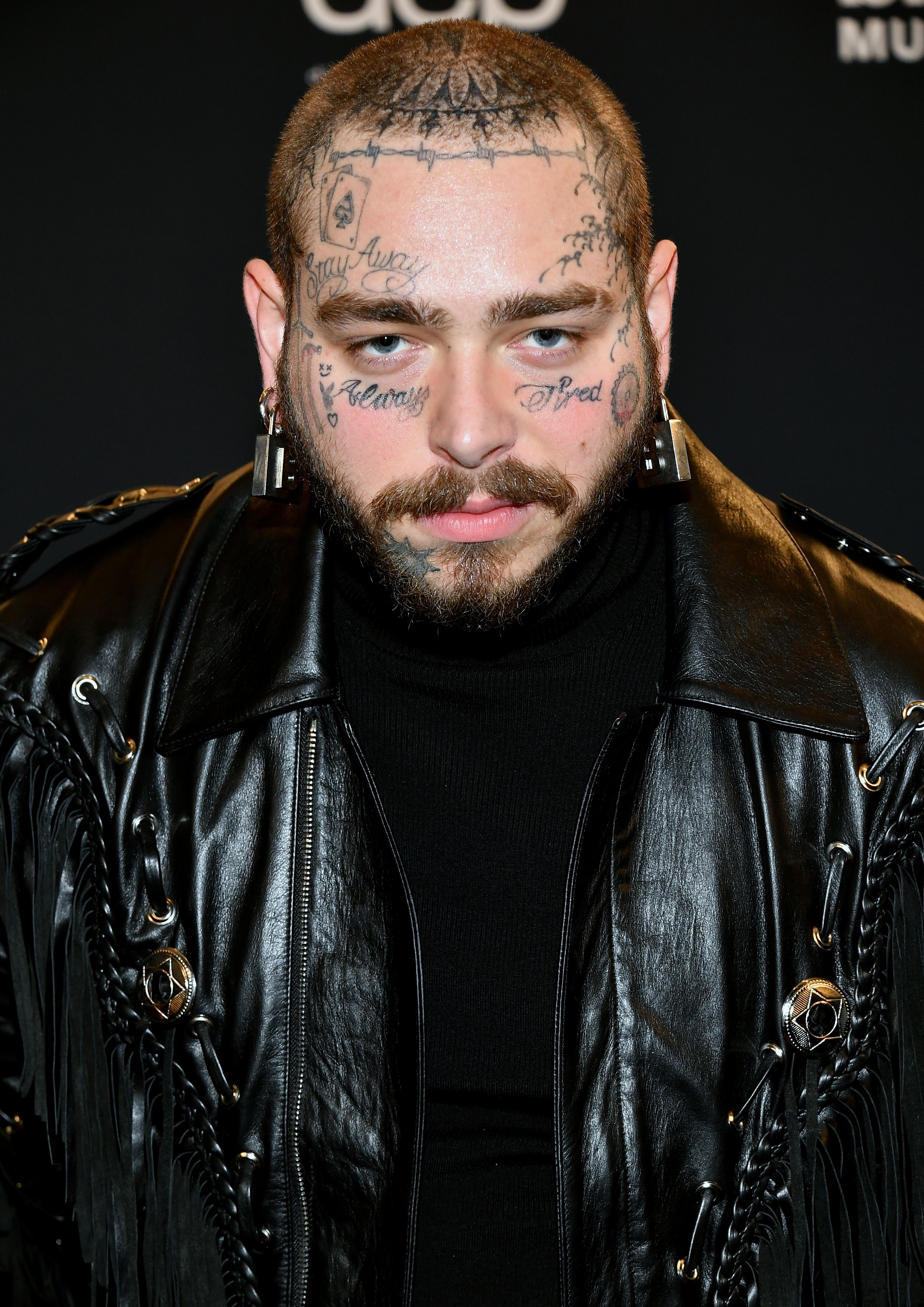 Post malone face tattoo says